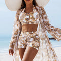 Tankini trois pièces Rivera par LSDLBoutique, motifs floraux jaune et blanc, avec paréo voile sur plage.