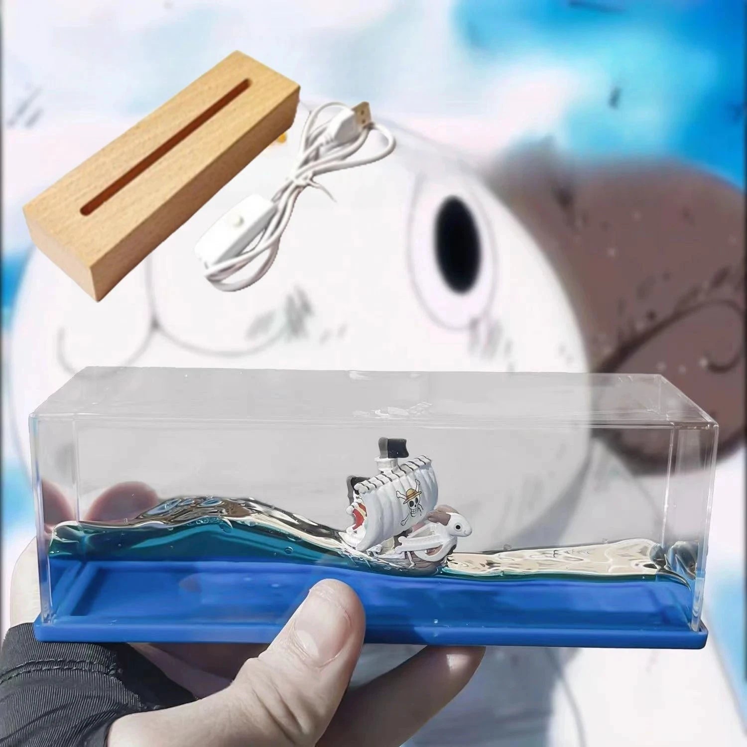 Décoration bateau Going Merry en liquide MINISO, miniature dans socle bleu et boîtier transparent