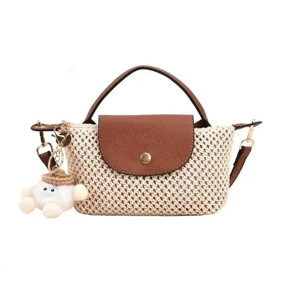 Sac à bandoulière tressé en paille naturelle avec rabat en cuir brun, petit sac seau pour plage.