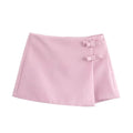 Jupe courte femme – Skort rose clair, effet wrap et deux petits noeuds sur le côté
