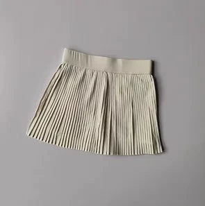 Jupe plissée tennis crème LSDLBoutique, jupe à large ceinture élastique.